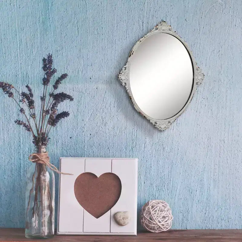 Miroir mural ovale en métal vieilli blanc