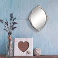 Miroir mural ovale en métal vieilli blanc
